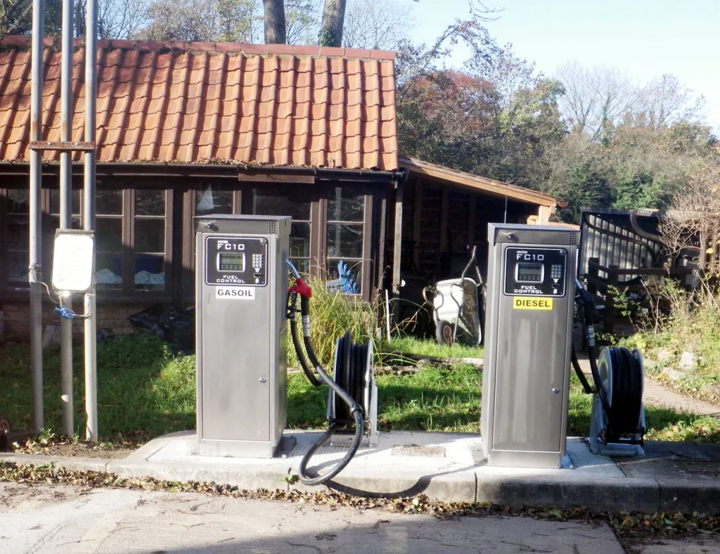 Two new commercial fuel pumps installed with hose-reels